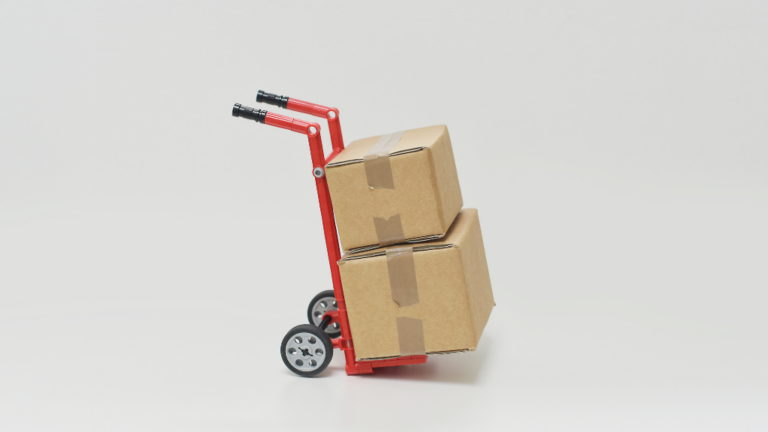 Supply Chain Security Two boxes stacked on a hand-pushed trolley. It sits alone with no one around it.
