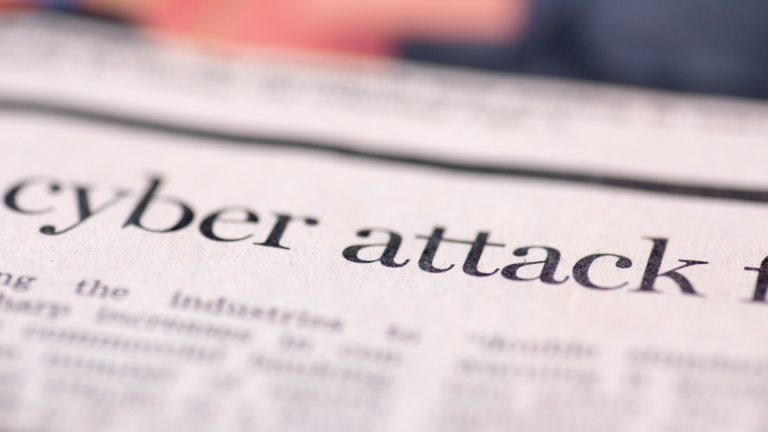Cyber Commercial crime newspaper headline saying cyber attack